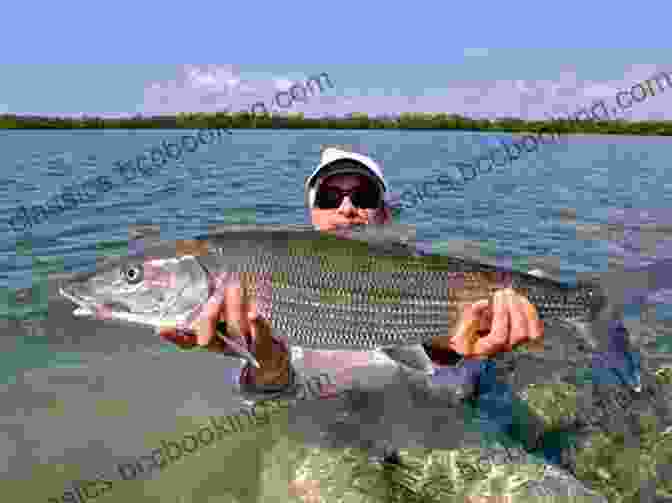 A Fisherman Holds Up A Giant Bonefish The Big One: An Island An Obsession And The Furious Pursuit Of A Great Fish